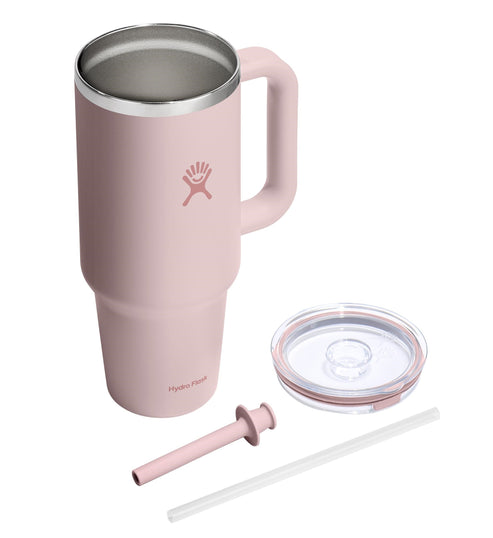 Pink mug with handle, lid, straw, and silicone straw tip.