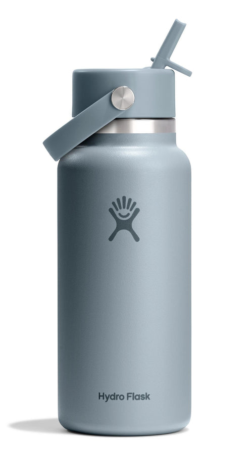 Blue insulated water bottle with straw.