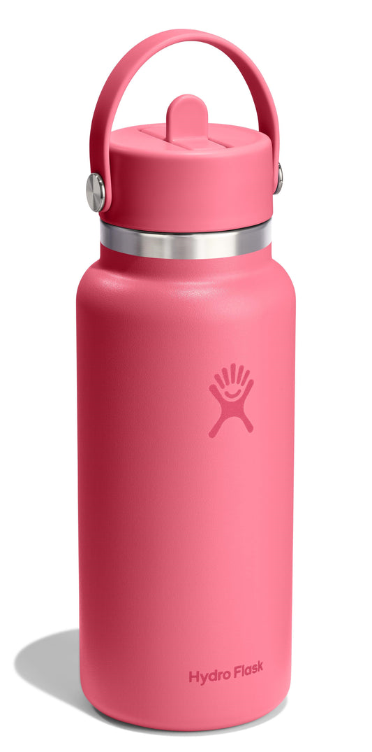 A pink water bottle with a handle on top.