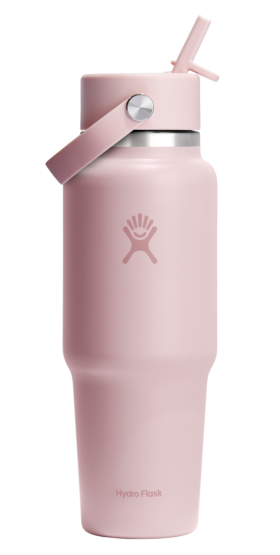 Pink stainless steel water bottle with a straw lid and carry handle.