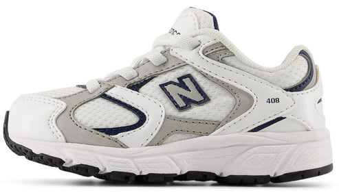 Low-top athletic shoe with white and gray upper, navy accents, white sole, and black bottom.