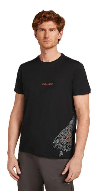 A man in a black shirt with a graphic design on the lower right.