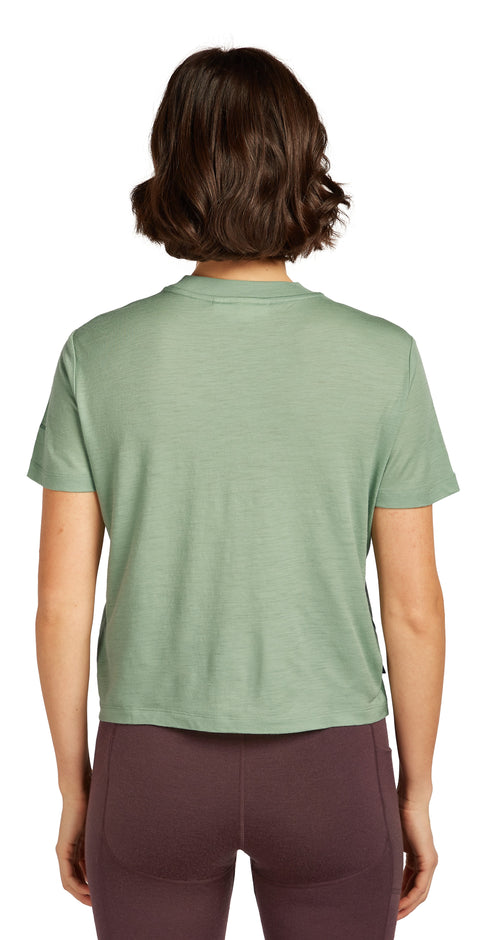 Person wearing a green T-shirt and maroon leggings, rear view.