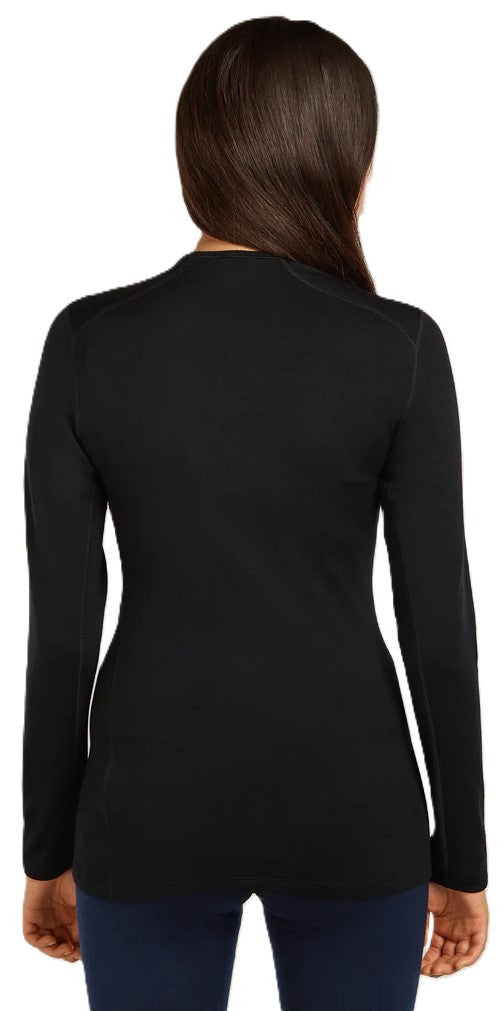 A woman wearing a black long-sleeved top.