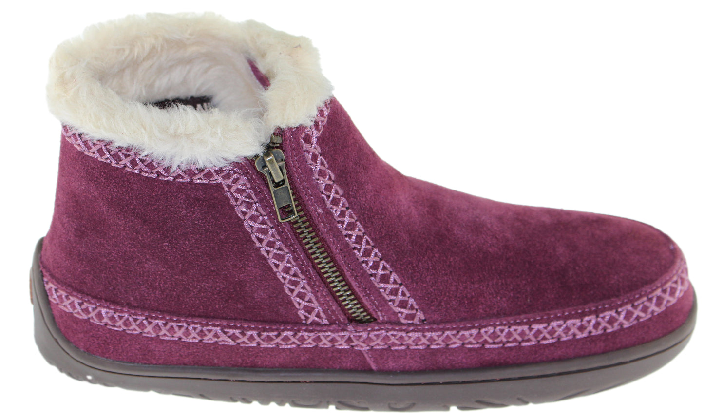 Purple suede slipper boot with zipper and faux fur trim.