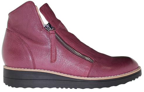 Burgundy, leather ankle boot with a side zipper and a black, platform sole.