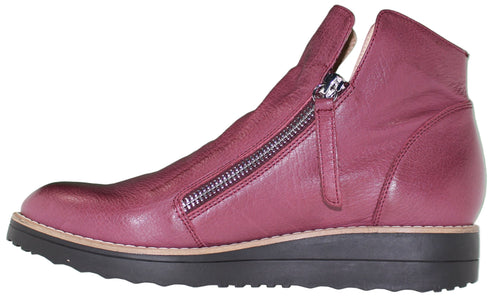 Burgundy, ankle-high boot with zipper closure and black platform sole.