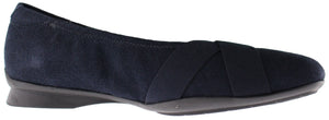 A navy blue ballet flat with crossing elastic straps.