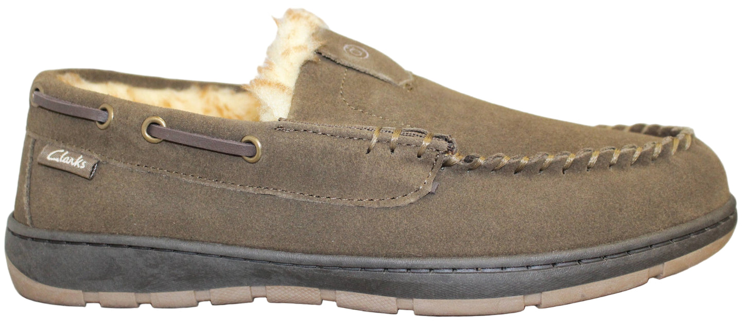 A moccasin style slipper with faux fur lining and visible Clarks logo.