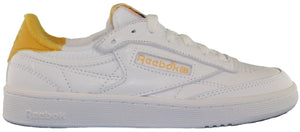 A white sneaker with a yellow accent on the heel and the Reebok logo.
