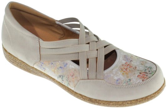 Beige flat shoe with woven elastic straps and floral print on the toe.