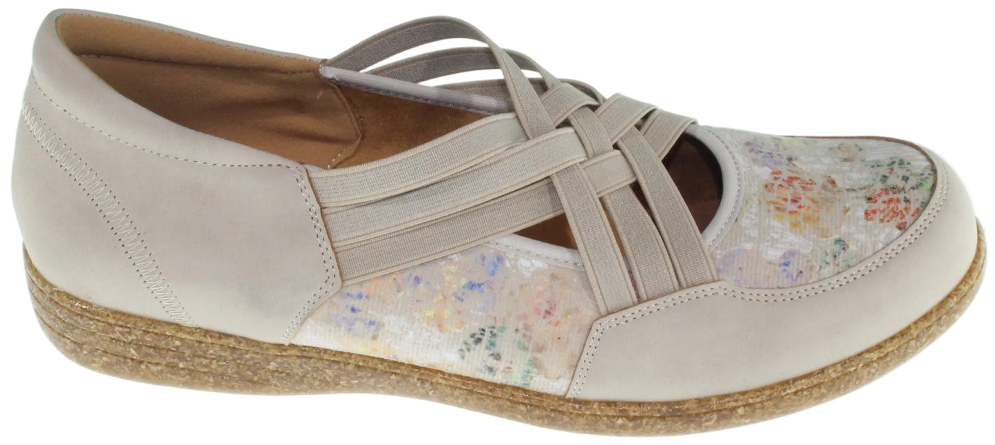 Beige Mary Jane shoe with floral print and criss-cross straps.