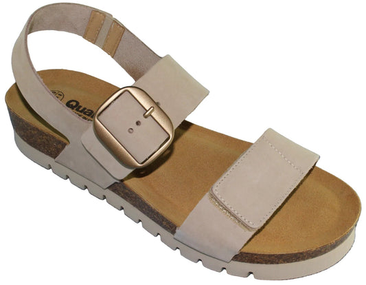 Beige sandal with a large gold buckle.
