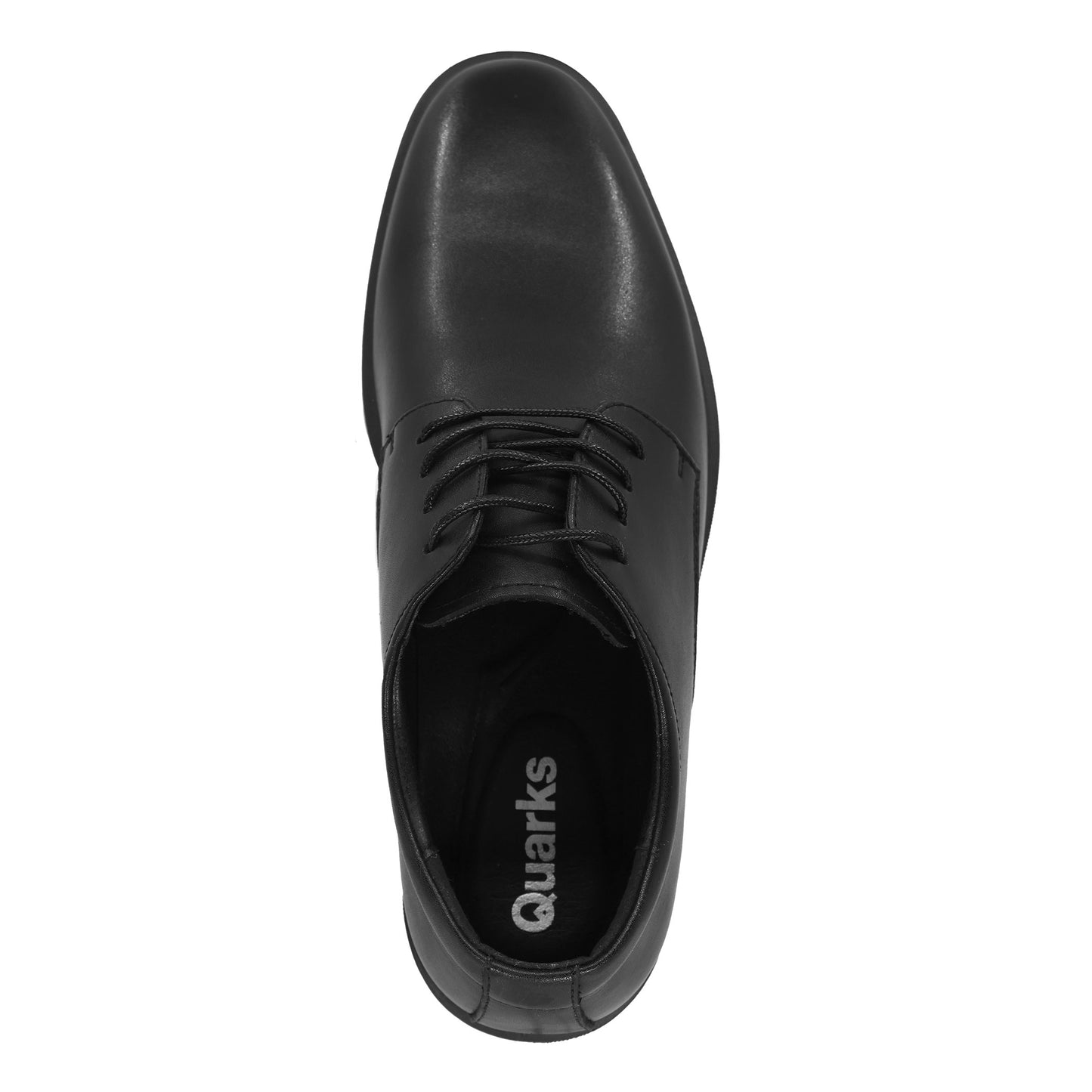 Overhead shot of a black dress shoe with laces and the text "Quarks" visible on the inner sole.