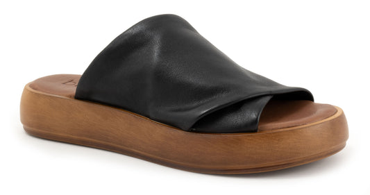 Black leather slide sandal with a brown platform sole.