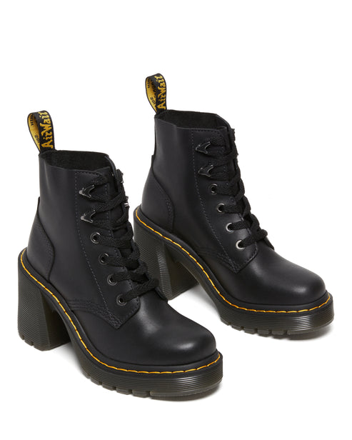 A pair of black leather ankle boots with thick, high heels and yellow accents.