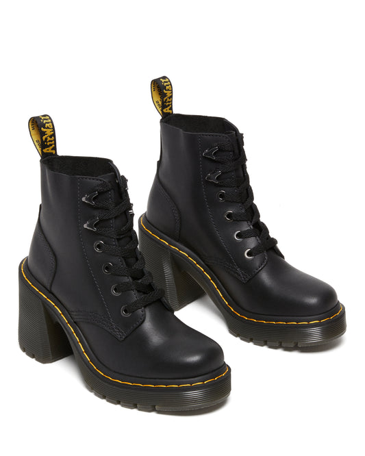 A pair of black leather ankle boots with thick, high heels and yellow accents.