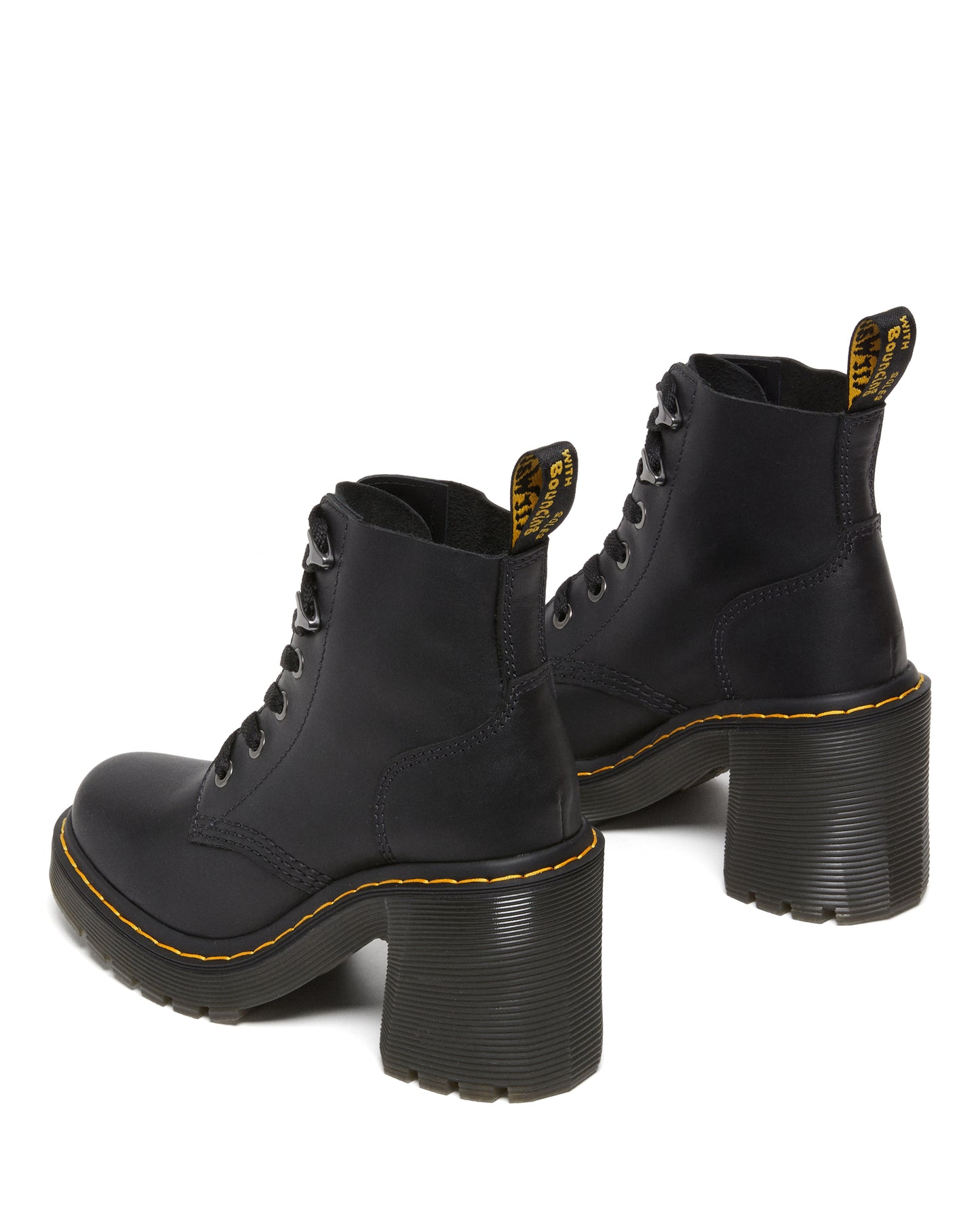 Pair of black leather heeled boots with yellow stitching.