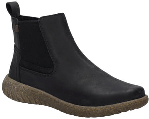 A black leather Chelsea-style ankle boot with a brown, textured, recycled-style rubber sole and a small black pull tab at the heel.