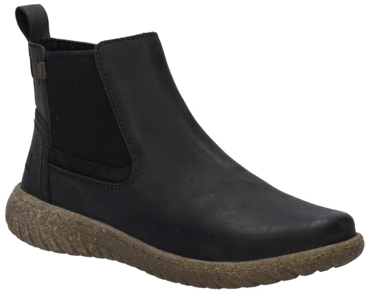 A black leather Chelsea-style ankle boot with a brown, textured, recycled-style rubber sole and a small black pull tab at the heel.