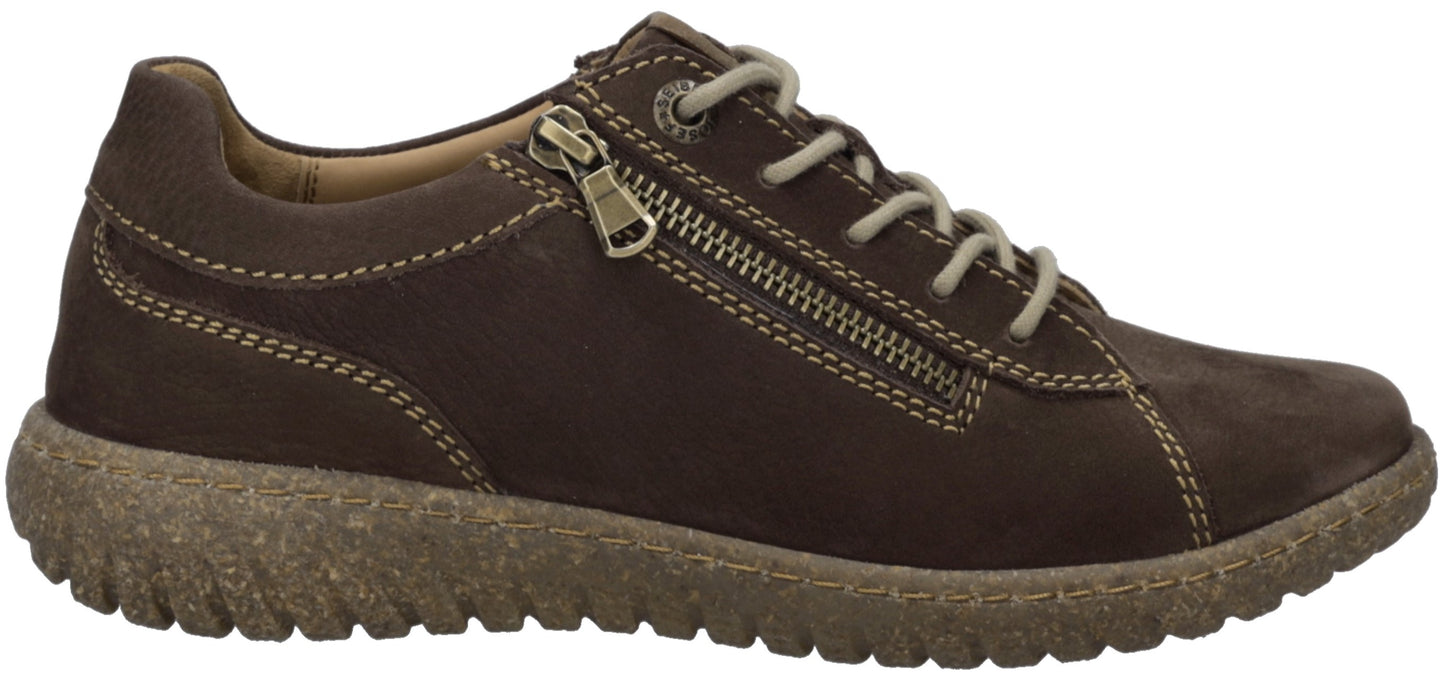 A brown leather low-top sneaker featuring a side zipper, white lacing, visible contrast stitching, and a thick, textured, gum-colored sole.