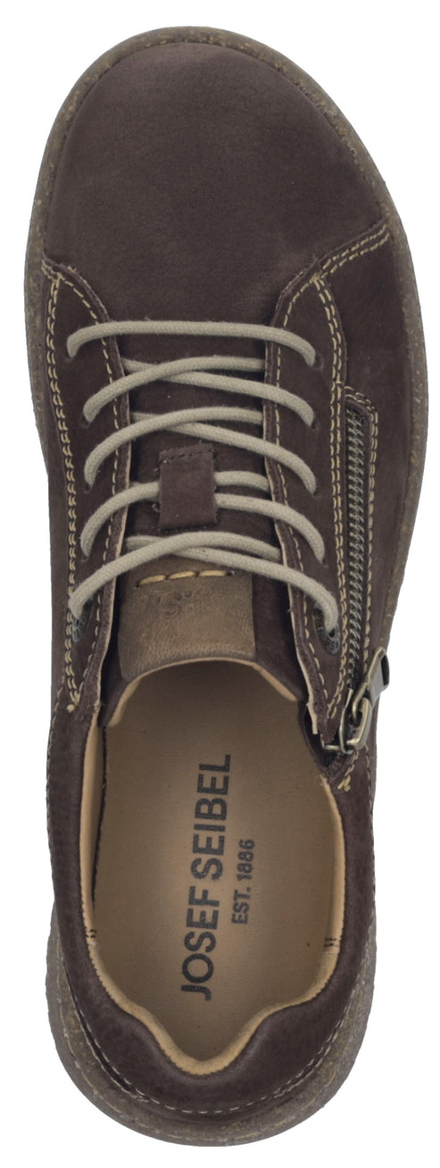 A top-down view of a dark brown suede sneaker featuring a side zipper, light beige laces, contrast stitching, and a branded insole that reads JOSEF SEIBEL EST. 1886.