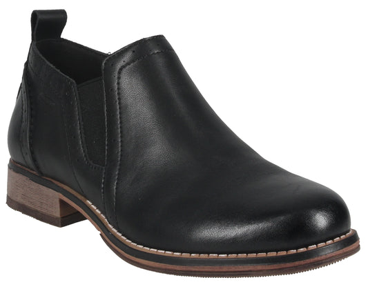A black leather slip-on ankle boot with a low, wood-grain stacked heel, side elastic gore panels, a rounded toe, and visible stitching along the sole.