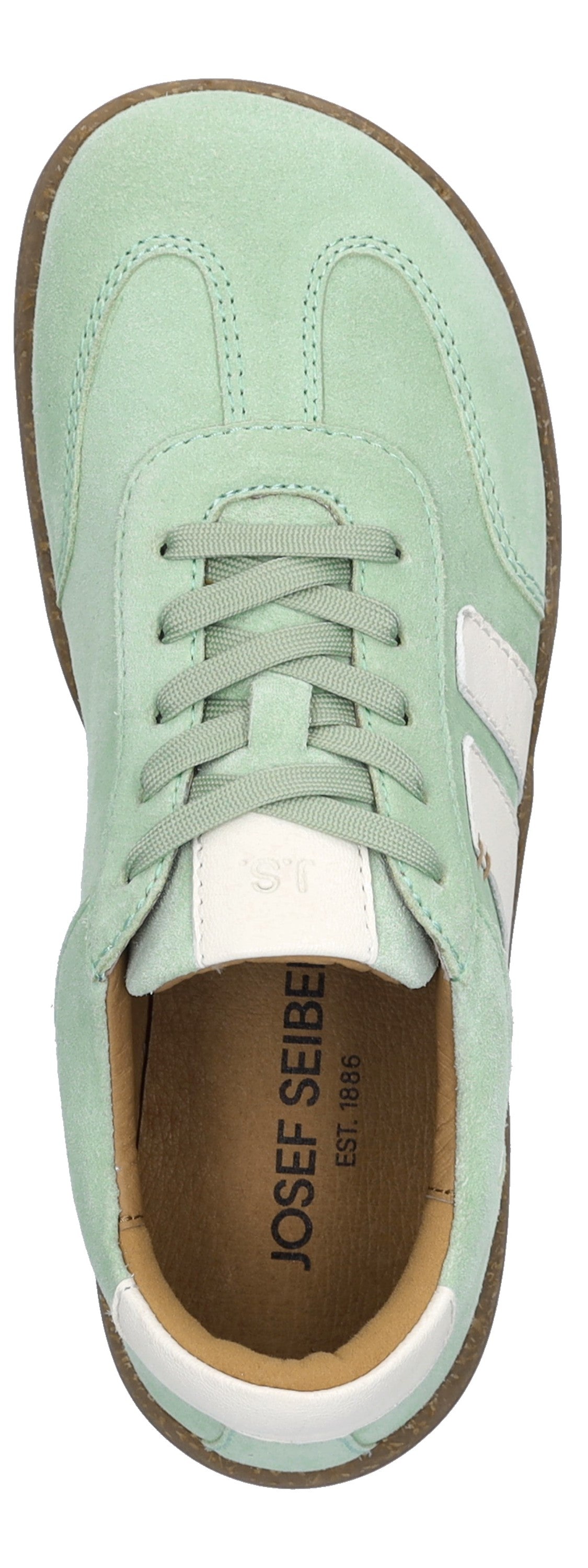 A top-down view of a light green sneaker with white stripes and laces.