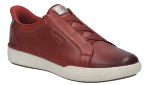 Red leather sneaker with a white sole, laceless top, and rounded toe.