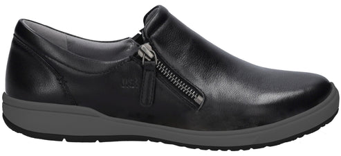 A black leather slip-on shoe with a side zipper closure, a grey sole, and a black bottom tread.