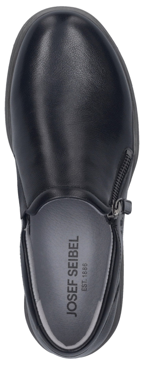 A top-down view of a black slip-on shoe with a small side zipper and the text Josef Seibel Est. 1886 printed on the light gray insole.