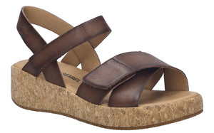 A dark brown sandal with a cork platform.