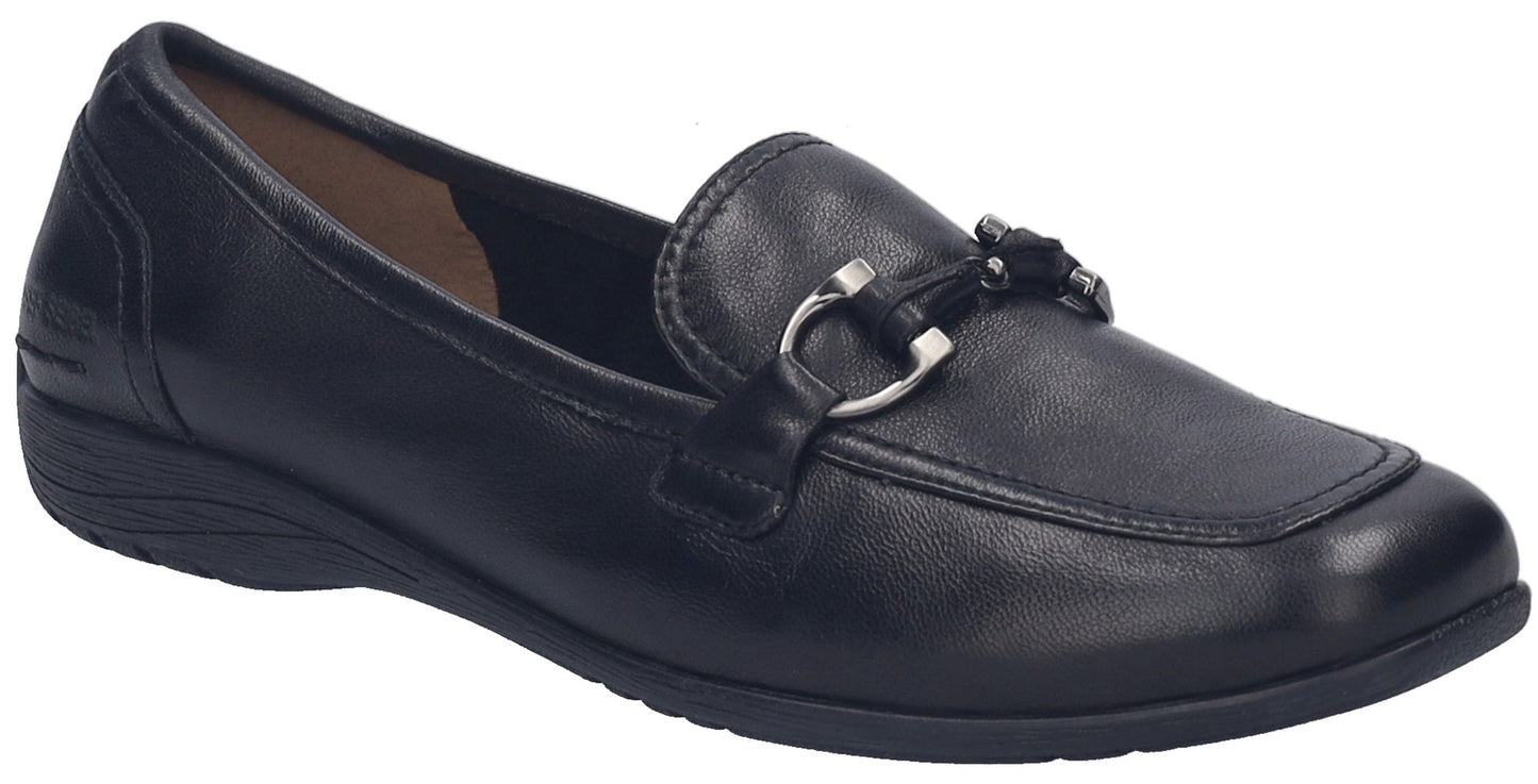 A black leather loafer shoe with a square toe, a low heel, and a silver-tone metal horsebit detail across the top.