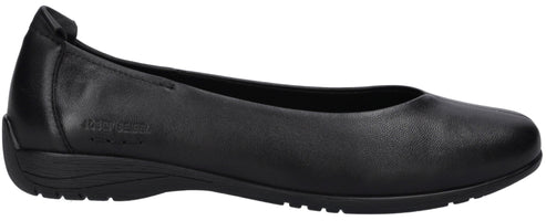 A side view of a black, flat, slip-on women's shoe with a smooth leather exterior, a rounded toe, and a low, textured rubber sole.
