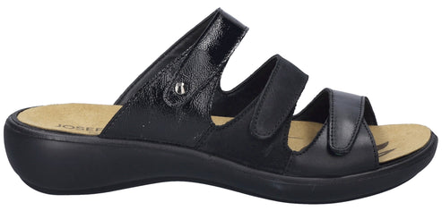 A black sandal with three straps and a slight wedge heel.