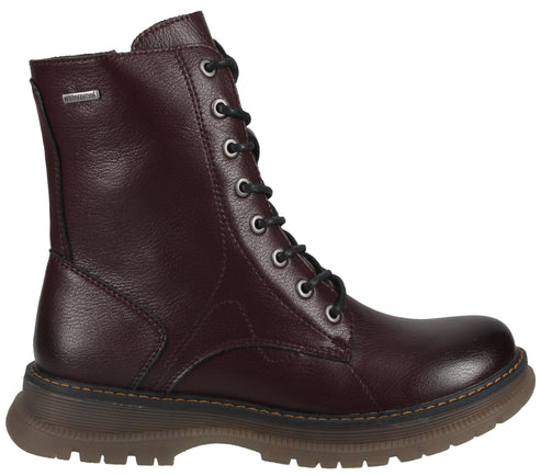 A maroon, leather-textured lace-up boot with metal eyelets, black laces, a silver logo tag on the side, and a thick, chunky, ridged brown sole.