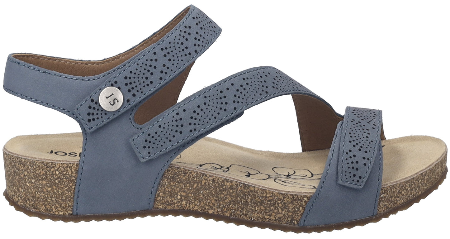 A blue sandal with cork sole and three adjustable straps.
