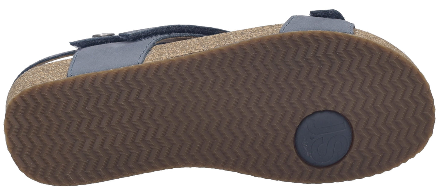 Sandal with brown sole.