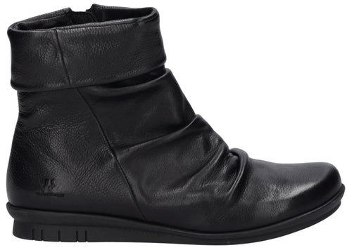 A black leather ankle boot with a folded cuff detail at the top, a ruched front, a smooth rounded toe, and a flat rubber sole, shown in profile.