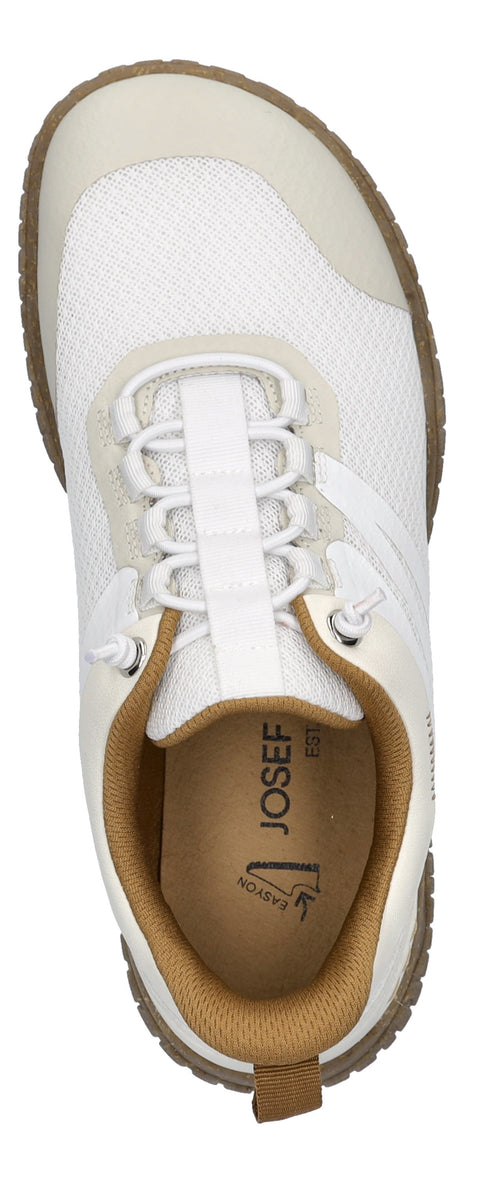 An overhead shot of a white athletic shoe with brown trim and sole, featuring white laces.