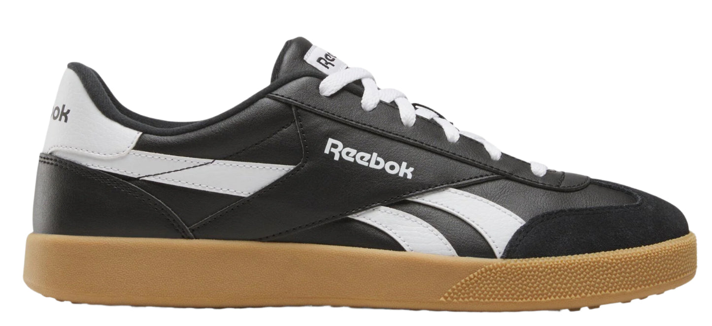 A black and white low top sneaker with a gum sole.