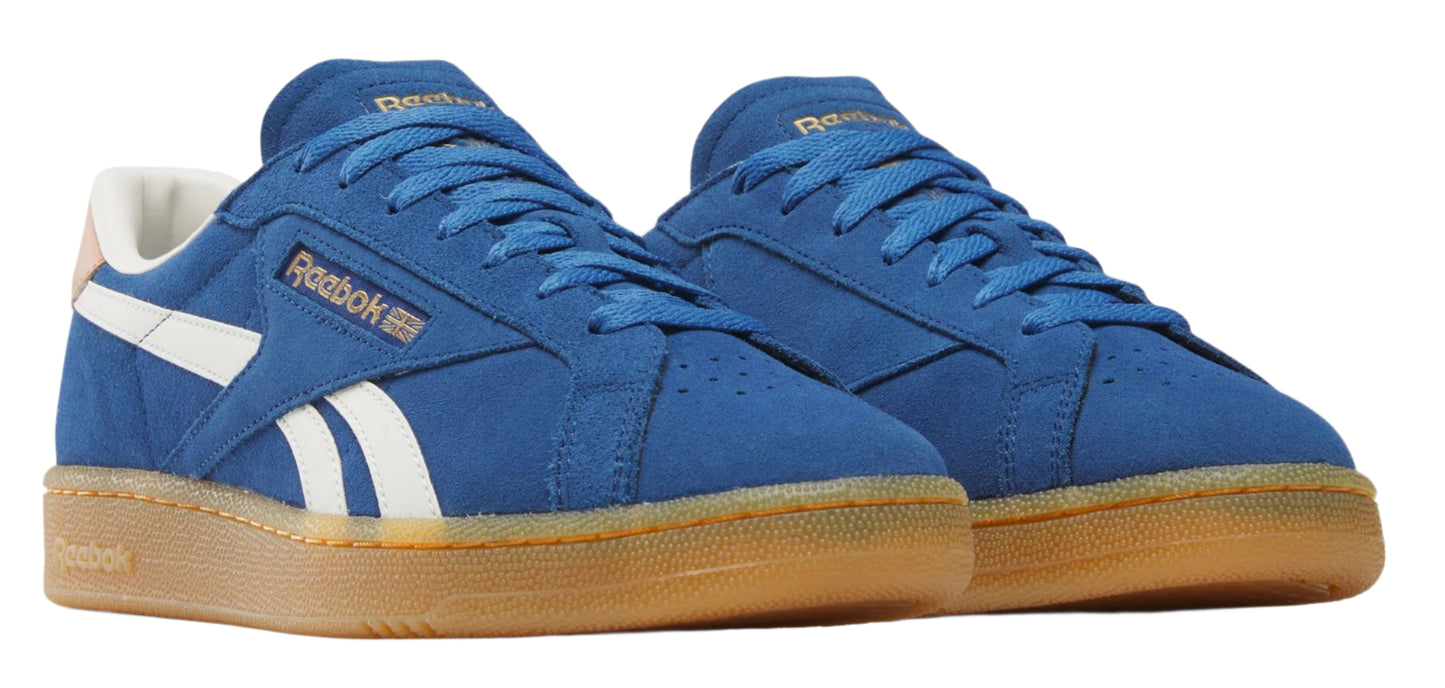 A pair of blue sneakers with white stripes and tan soles.