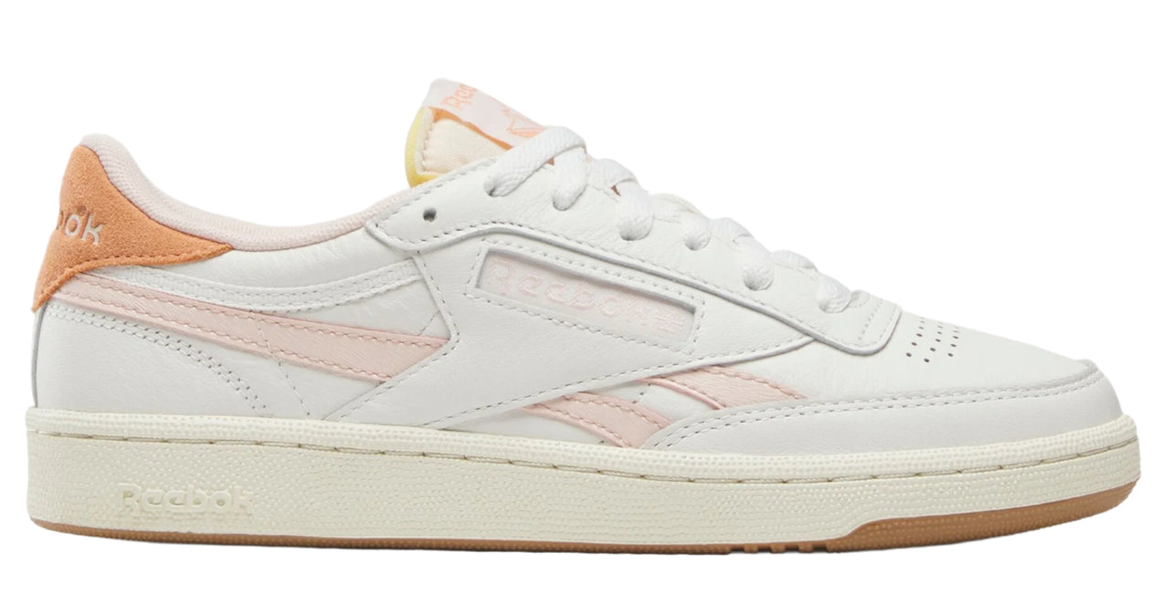 White low-top sneaker with peach accents.