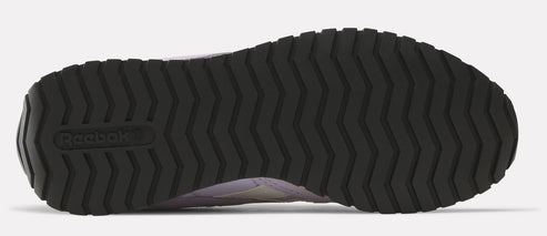 The bottom view of a sneaker featuring a black, deeply treaded sole with the Reebok logo near the heel.