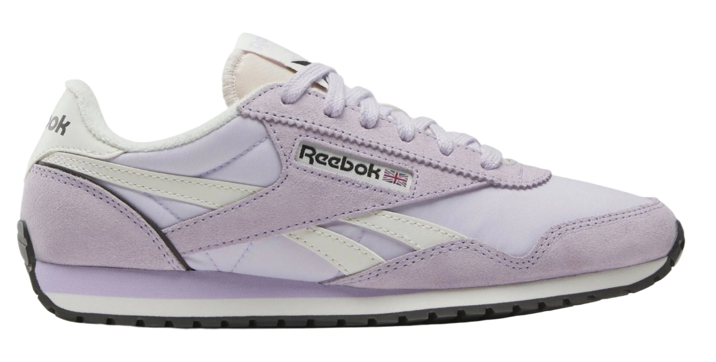 Lavender sneaker with white stripes and "Reebok" logo.