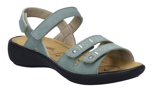 Light blue sandal with two straps decorated with silver studs over the toe area and one strap over the ankle. The sole is black.