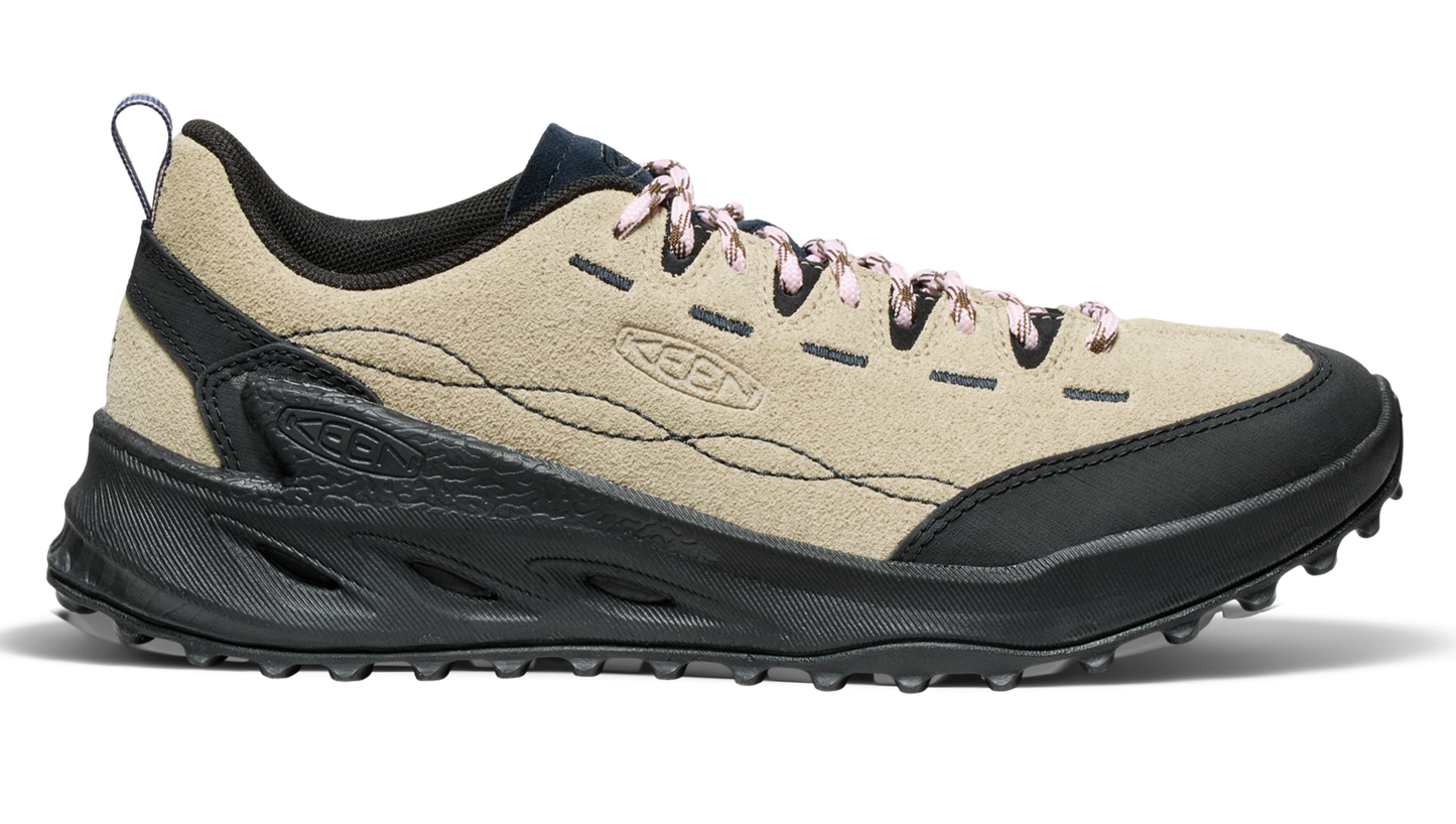 Tan and black athletic shoe with patterned laces.