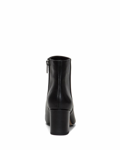 Back view of a black ankle boot with a block heel and a side zipper.