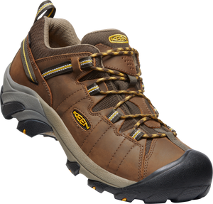 Brown leather hiking shoe with black toe cap and speckled brown and black laces.