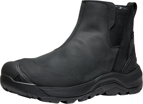 Black Chelsea boot with thick treaded sole and toe cap.